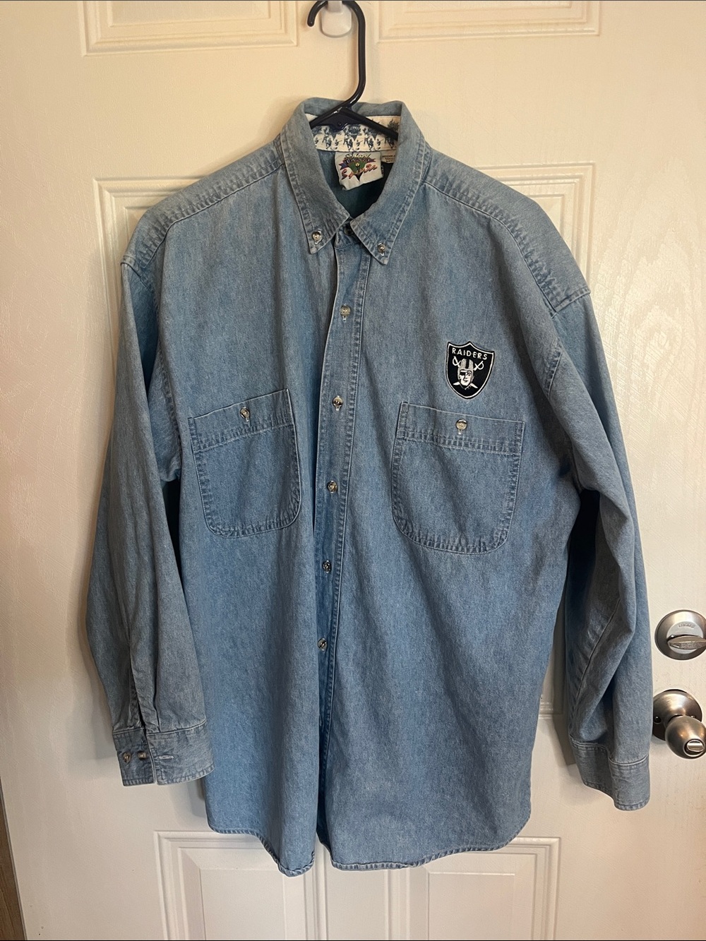 Vintage Denim Button-Down Shirt with Raiders Patch